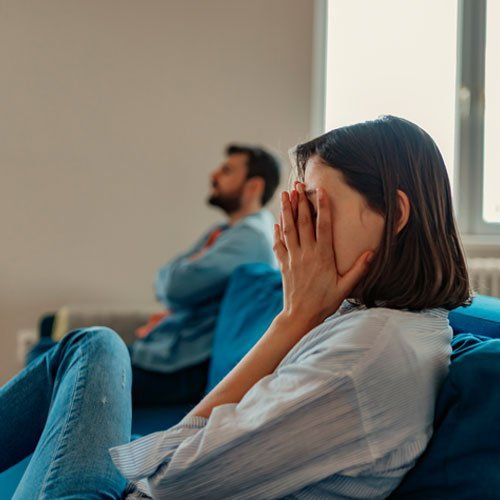 Unhappy Couple After an Argument in the Living Room at Home — Beenleigh, QLD — Christobel Counselling