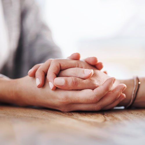 People Holding Hands in Comfort — Beenleigh, QLD — Christobel Counselling